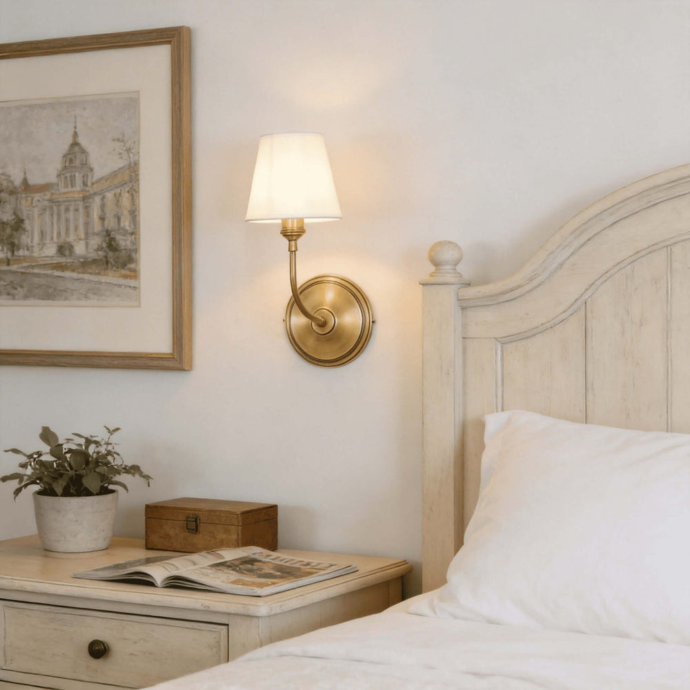 Brass single-light Multi Wall Sconce beside a rustic bedroom headboard