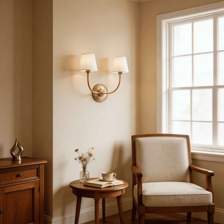 Brass two-light Multi Wall Sconce illuminating a reading corner by the window