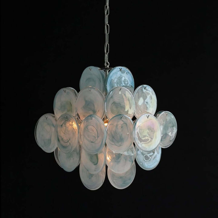 Glowing blue Murano Disk Chandelier with layered iridescent glass discs against a black background