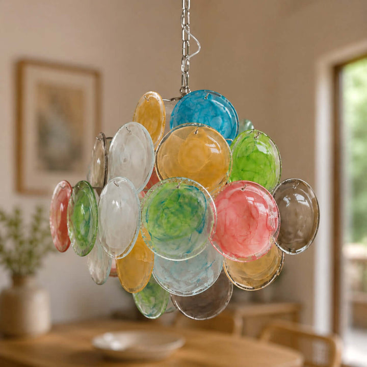 Close view of a multicolor Murano Disk Chandelier with blue, green, amber, pink, and smoke glass discs
