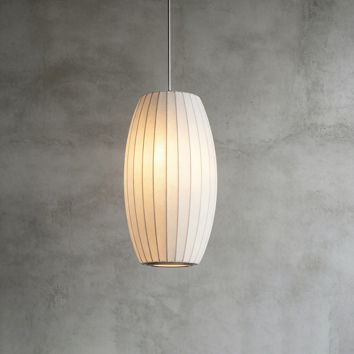 Elongated oval Nelson Bubble pendant light with vertical ribs and soft warm illumination