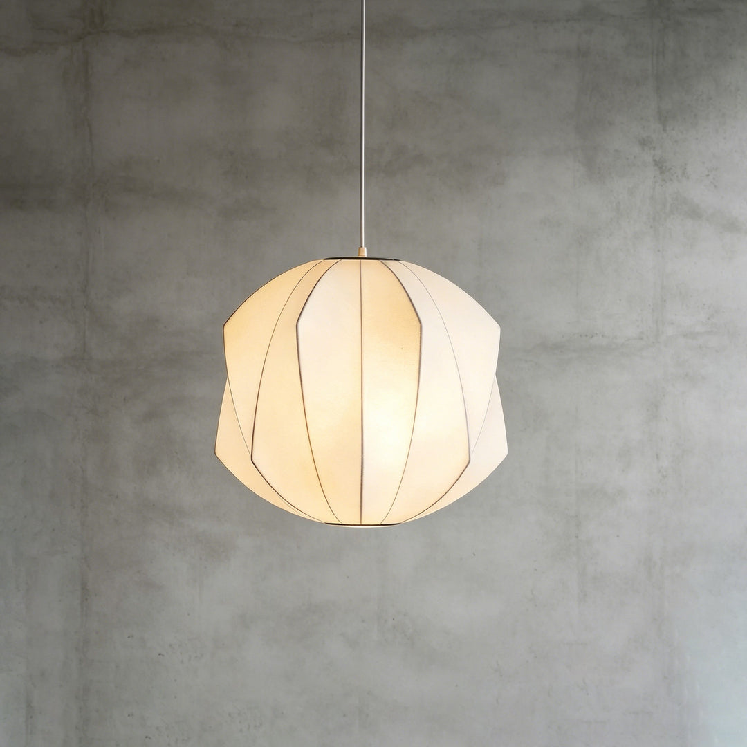 Faceted round Nelson Bubble pendant lamp with layered geometric panels and warm diffused light