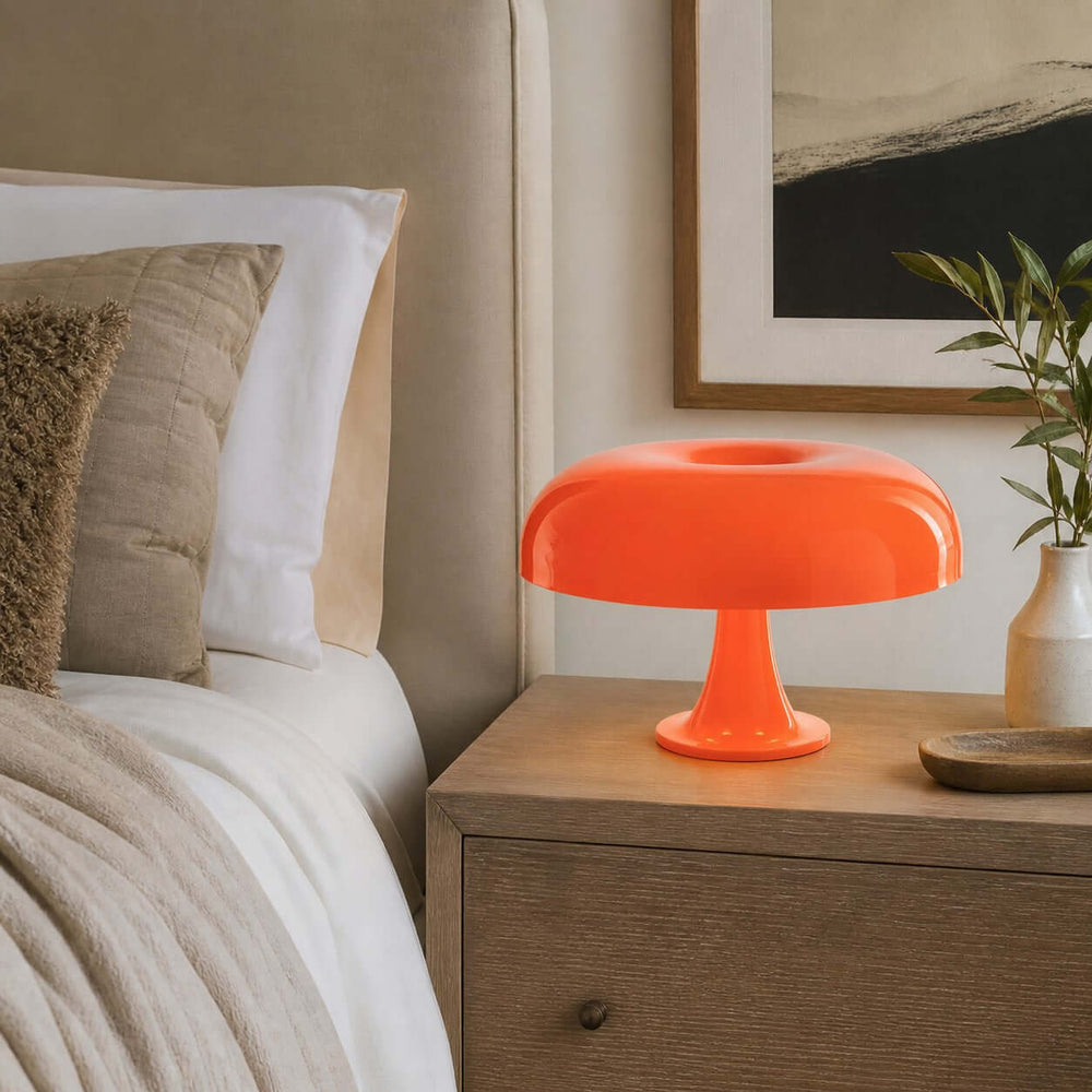 Orange Nesso Table Lamp adding a colorful accent to a neutral bedroom nightstand