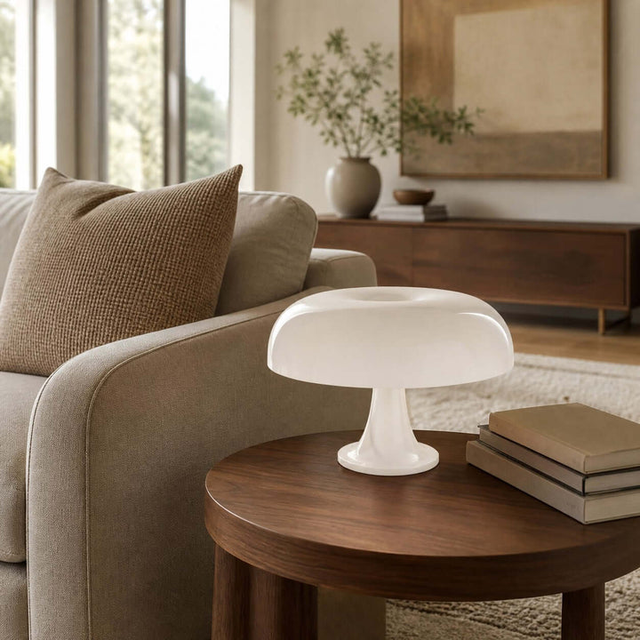 White Nesso Table Lamp on a wood side table beside a neutral living room sofa