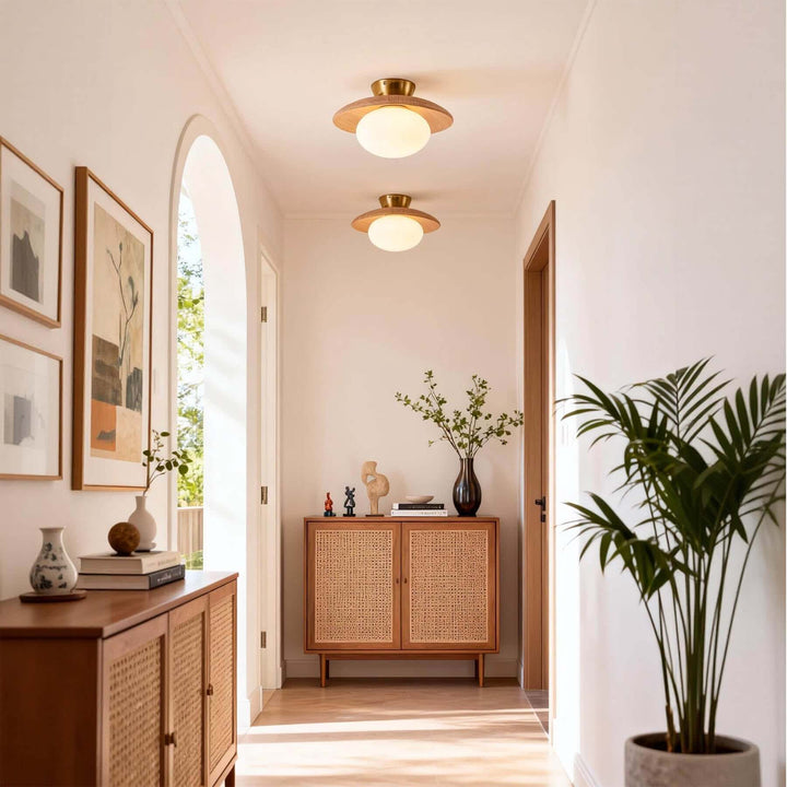 Nordic light wood flush mount lights in a bright hallway with arched openings