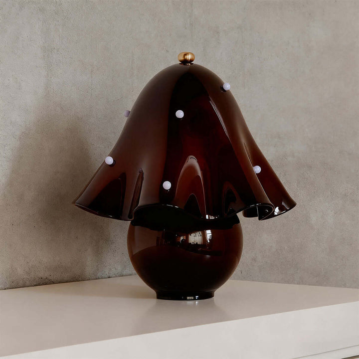 Spotted brown glass table lamp with sculptural shade and contrasting white accents