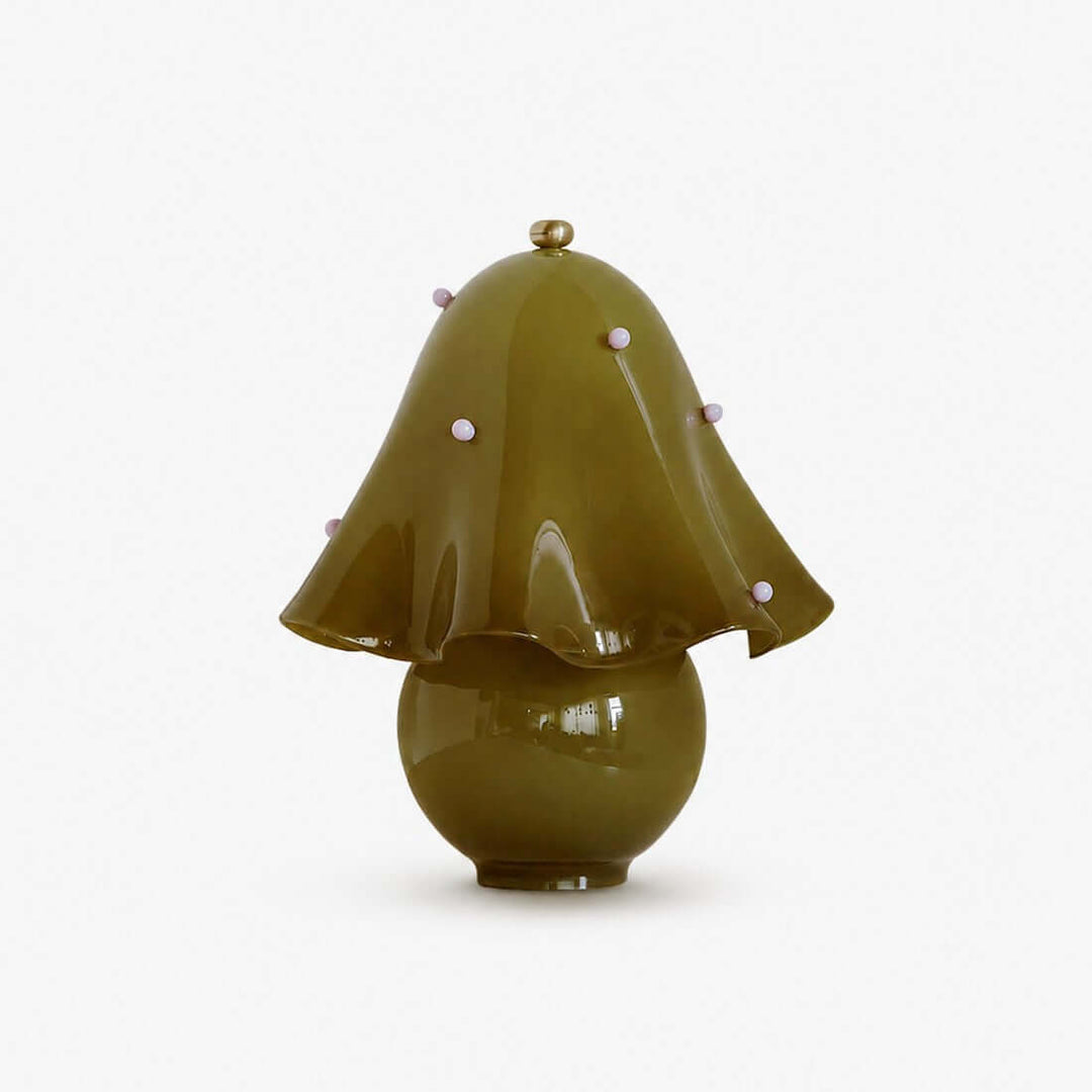 Novrae spotted green glass table lamp with sculptural flower shade and round base
