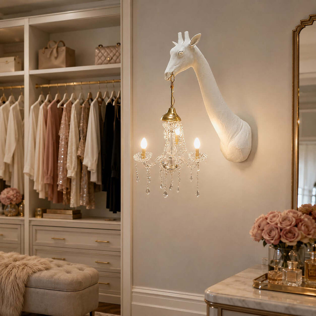 White Nuvexa giraffe wall sconce with a gold crystal chandelier in an elegant walk-in closet