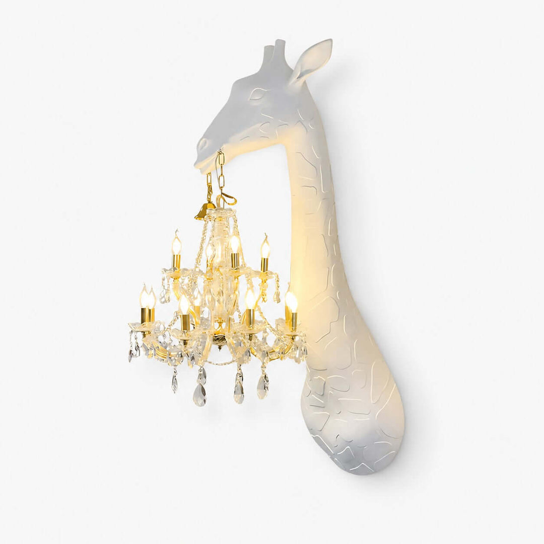 Nuvexa white and gold giraffe wall lamp featuring a sculpted giraffe holding an illuminated crystal chandelier