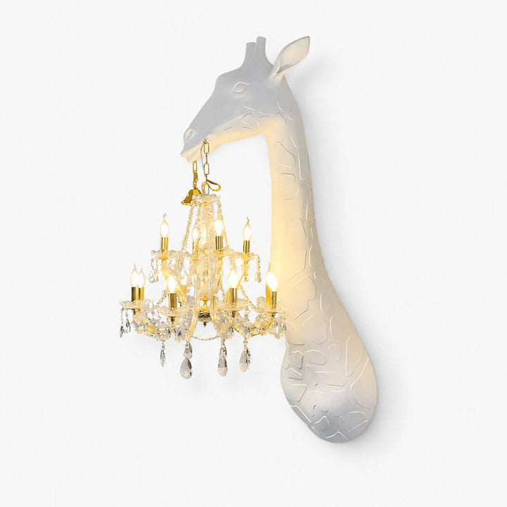 Nuvexa white and gold giraffe wall lamp featuring a sculpted giraffe holding an illuminated crystal chandelier