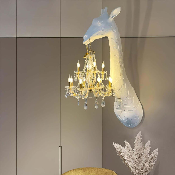 White and gold Nuvexa giraffe wall lamp displayed on a contemporary paneled wall with warm illumination