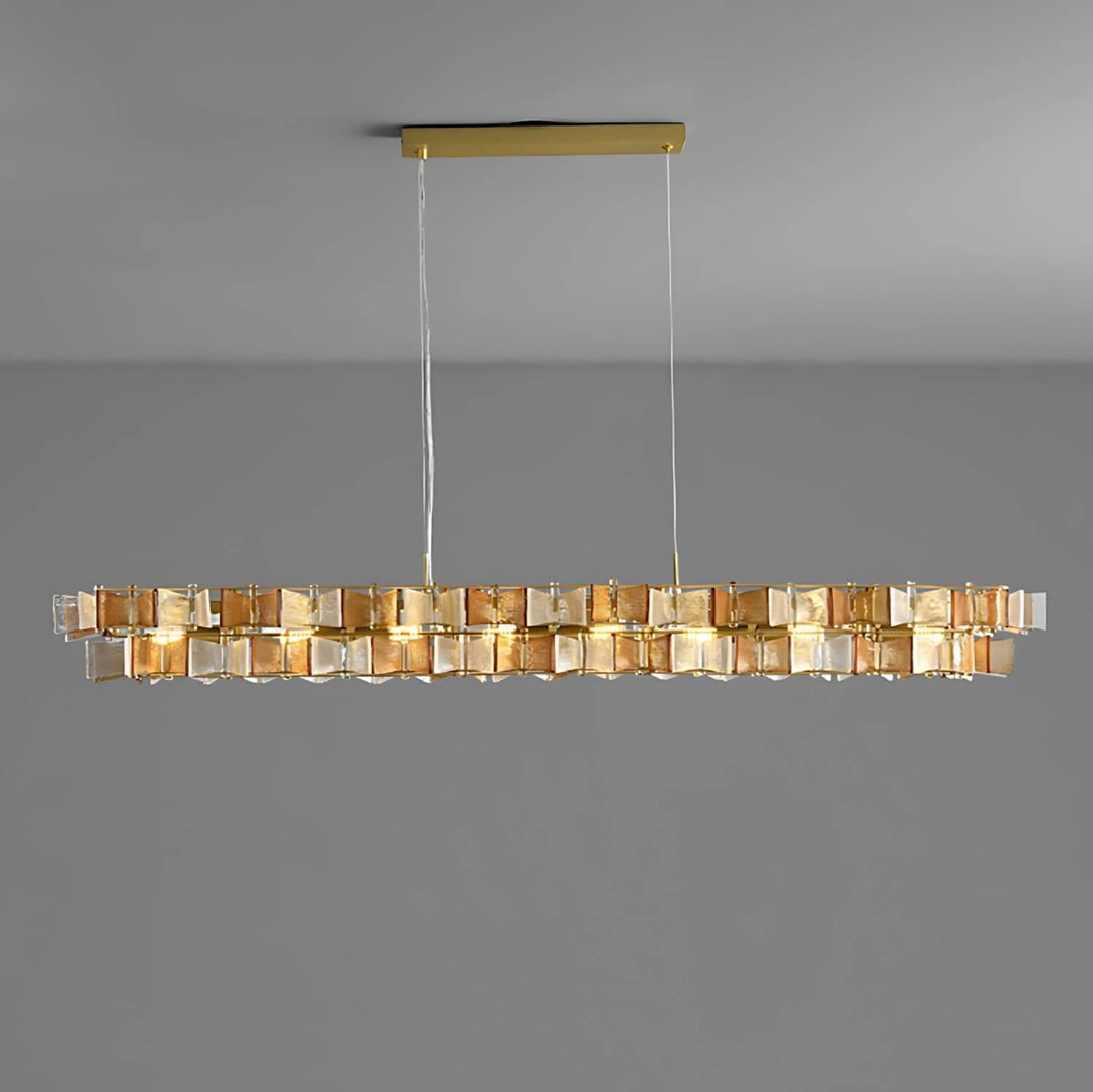 Amber Orvex linear chandelier with layered glass panels on a gray background