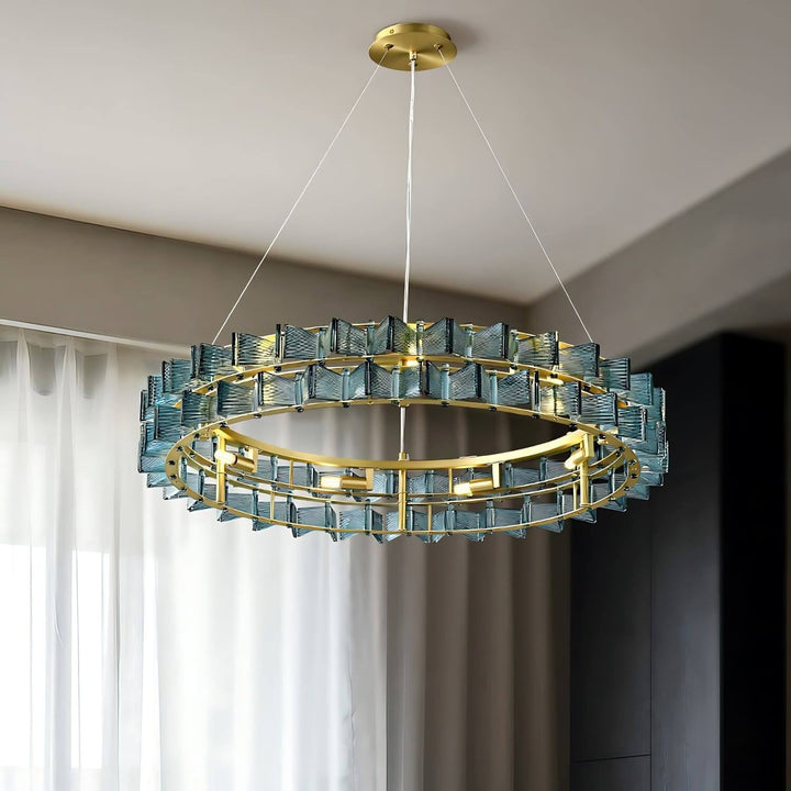 Blue Orvex round chandelier shown from an angled view in a bright contemporary room