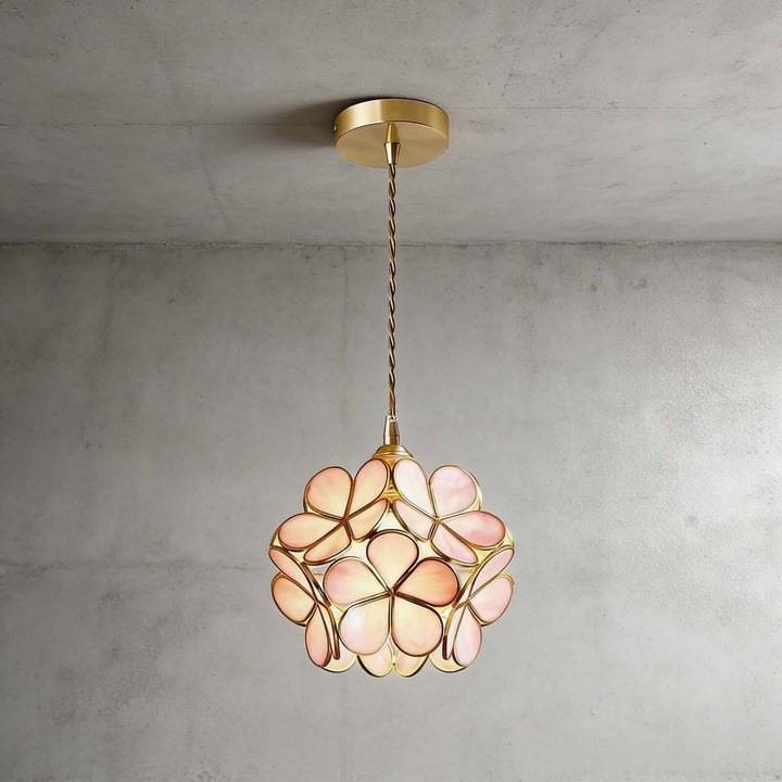 Pink stained glass petal pendant light with floral shade and antique brass hardware