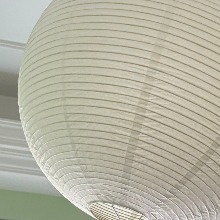 Close-up of the rice paper texture and internal wire ribs on the round lantern shade