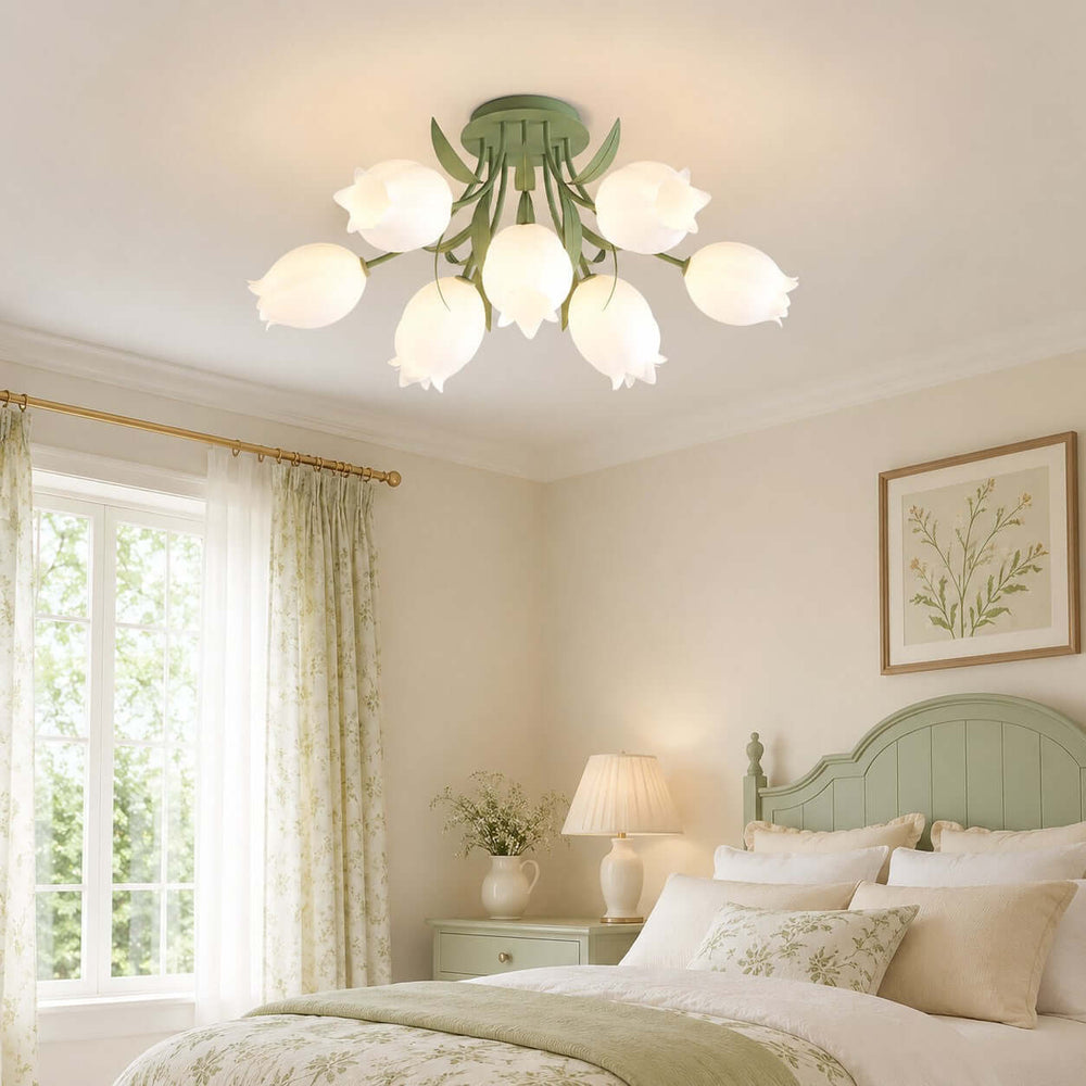 Ricko green flower ceiling light above a soft cottage bedroom with a sage headboard and floral curtains.