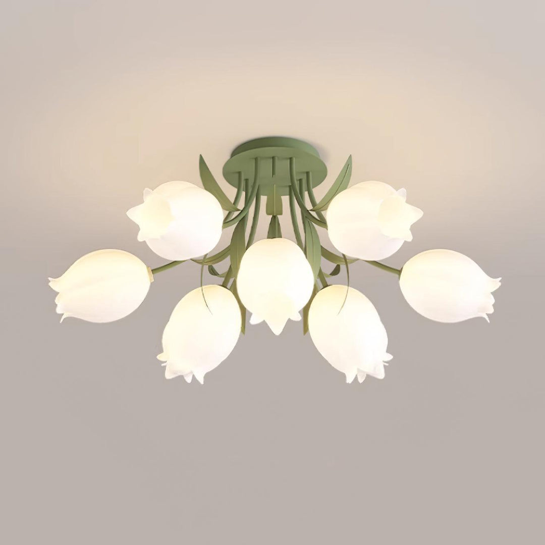 Ricko green ceiling light with a compact arrangement of glowing cream flower shades against a neutral ceiling.