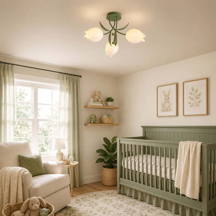 Three-light Ricko green ceiling light above a sage crib in a warm, nature-inspired nursery.