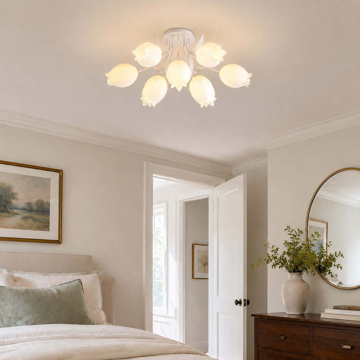 Ricko white bedroom ceiling light fixture above a classic bed, wood dresser, and round mirror.