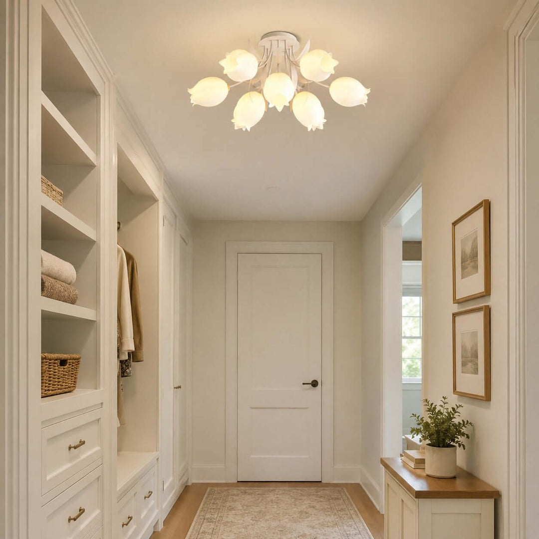 Ricko white ceiling light illuminating a narrow hallway with built-in storage and warm wood accents.