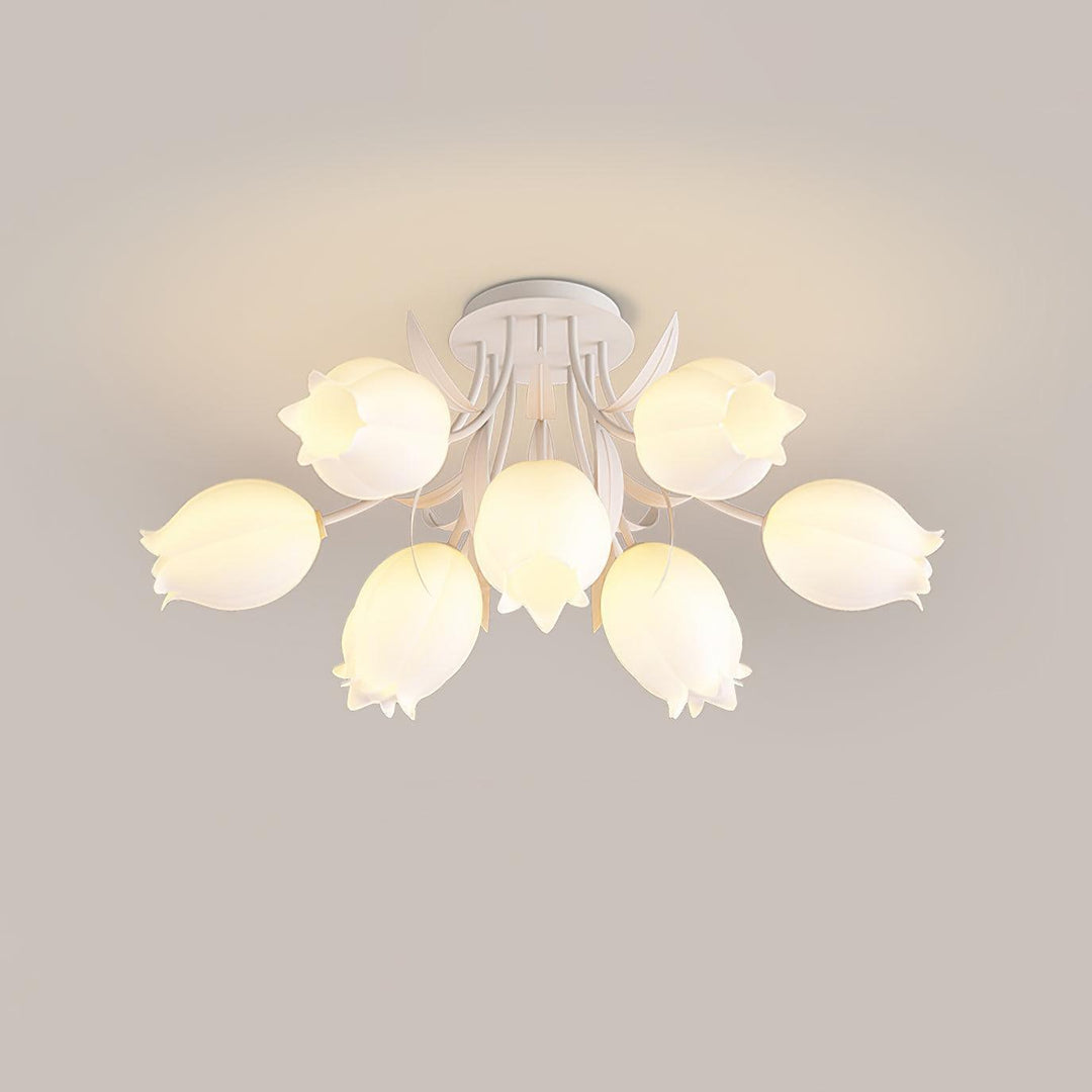 Ricko white ceiling light with a compact cluster of glowing lily-shaped shades viewed from below.