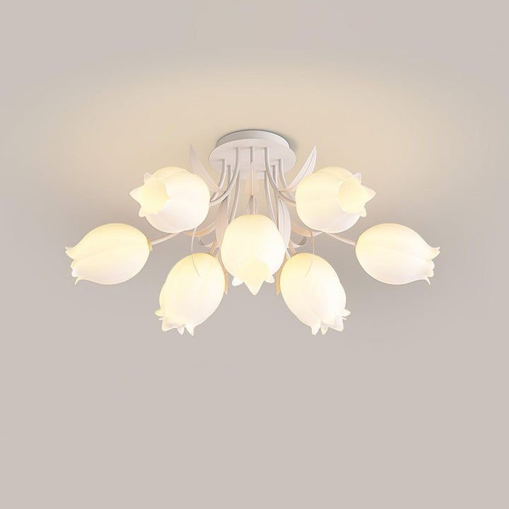 Ricko white ceiling light with a compact cluster of glowing lily-shaped shades viewed from below.