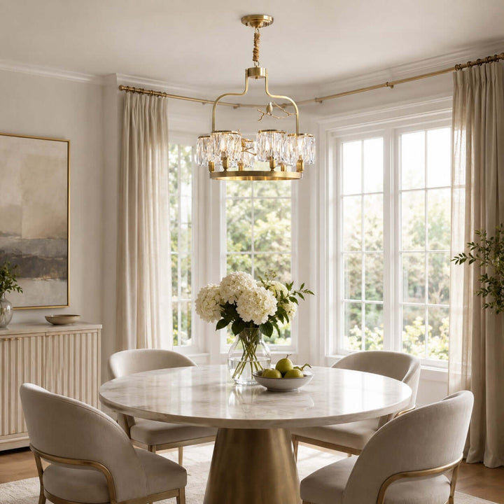 Six-light Crystal Bird Chandelier above a round white table in a sunlit dining nook with large windows