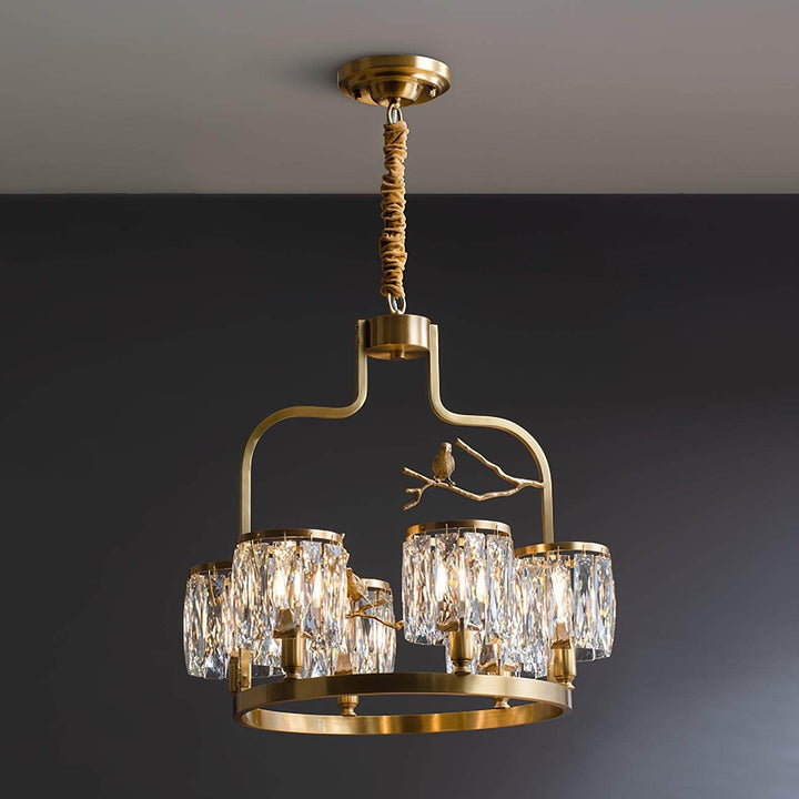 Six-light Crystal Bird Chandelier shown unlit with a brass frame, clear crystal shades and bird accents