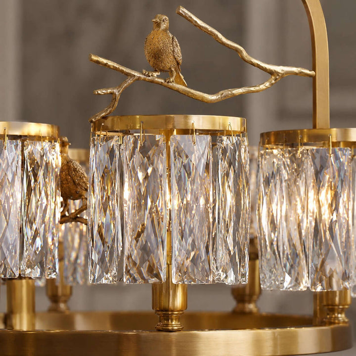 Six-light Crystal Bird dining room chandelier glowing above a table against a dark modern backdrop