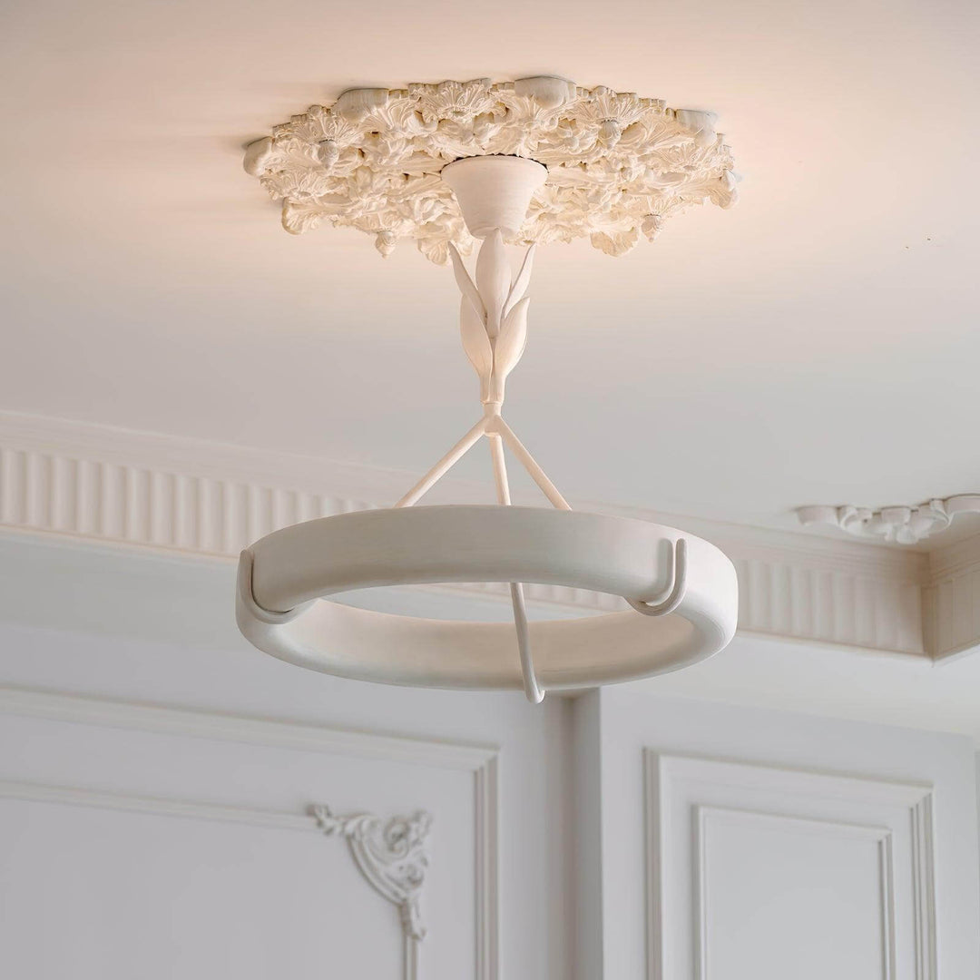 Full view of the Tinsley plaster chandelier installed beneath an ornate floral ceiling medallion.