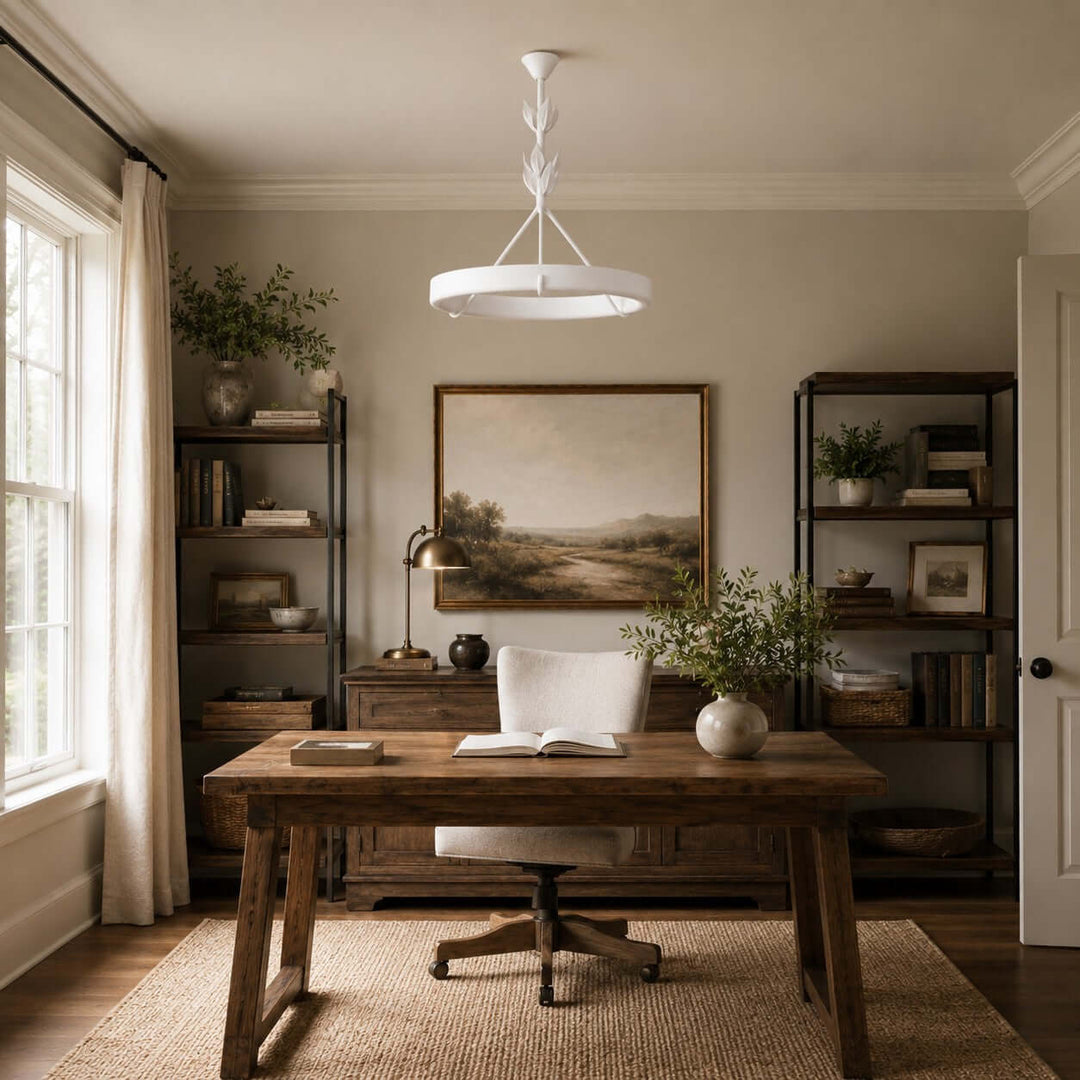 Tinsley plaster chandelier centered above a wood desk in a traditional home office with open shelving.