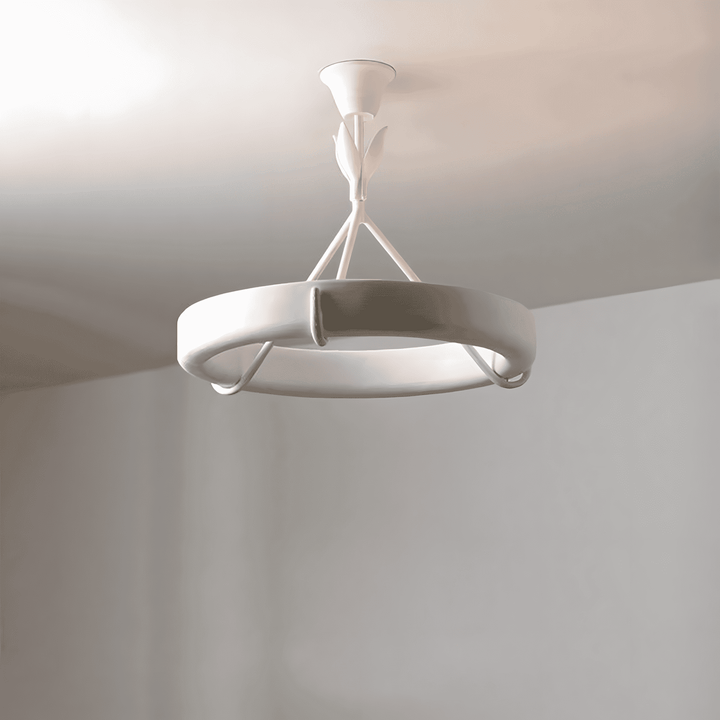 Low-angle view of the Tinsley plaster chandelier showing its circular ring, leaf stem, and curved supports.