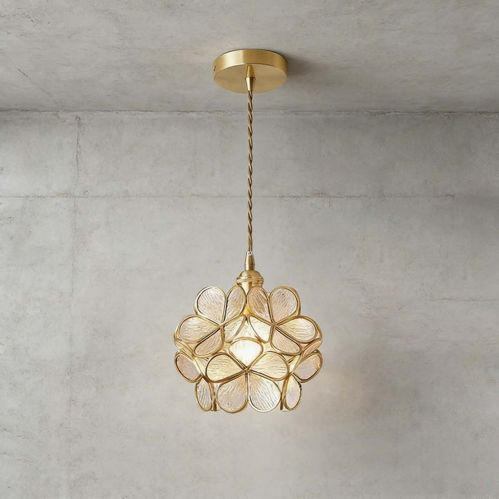 Transparent B glass petal pendant light with textured clear petals and brass frame