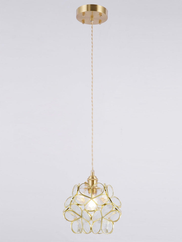 Full view of a transparent glass petal pendant light with brass canopy and adjustable cord