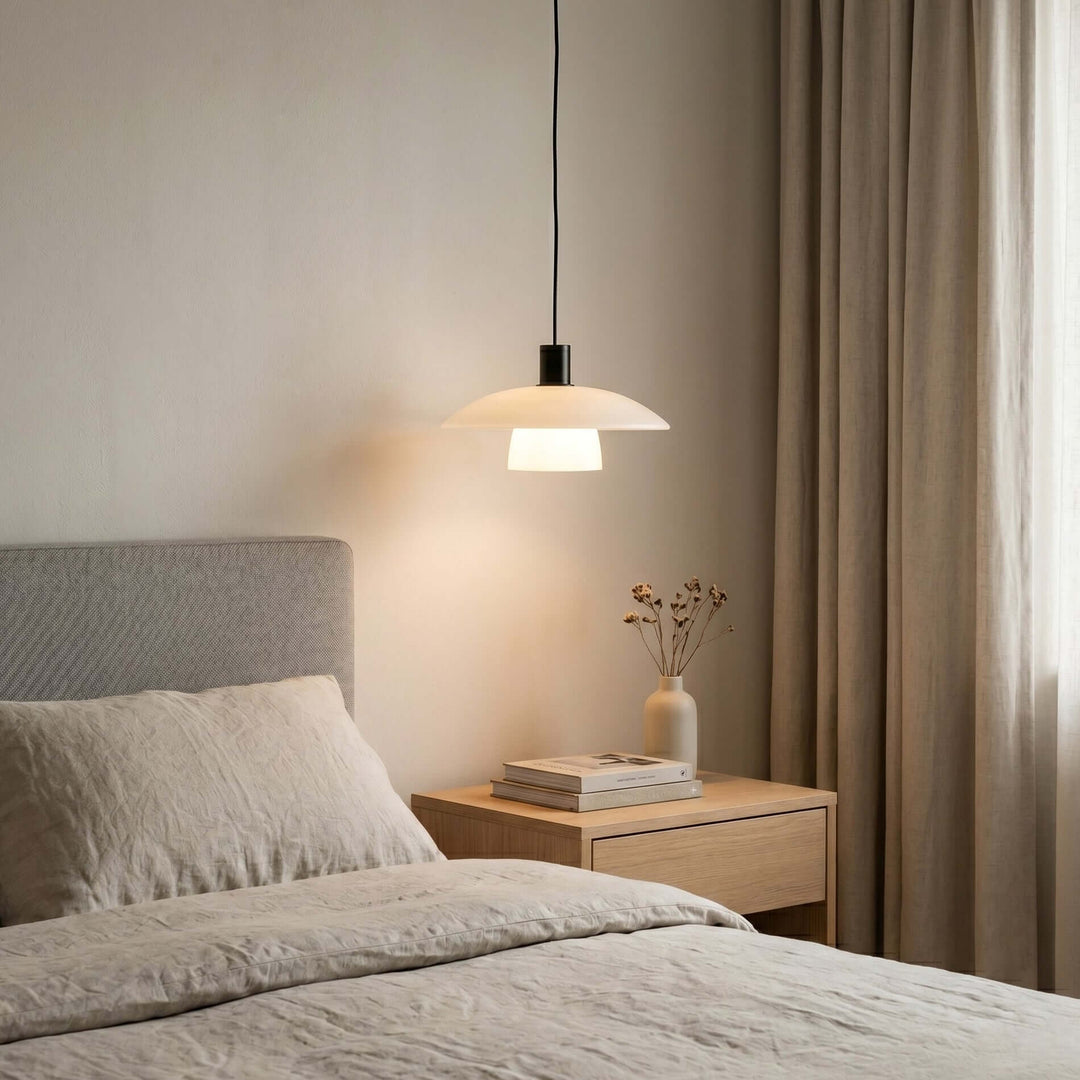 Verona pendant lamp above a wood nightstand in a warm neutral bedroom