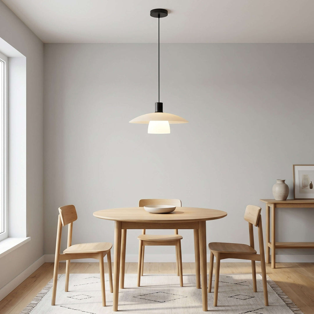 Verona pendant lamp above a round light wood table beside a sunlit window