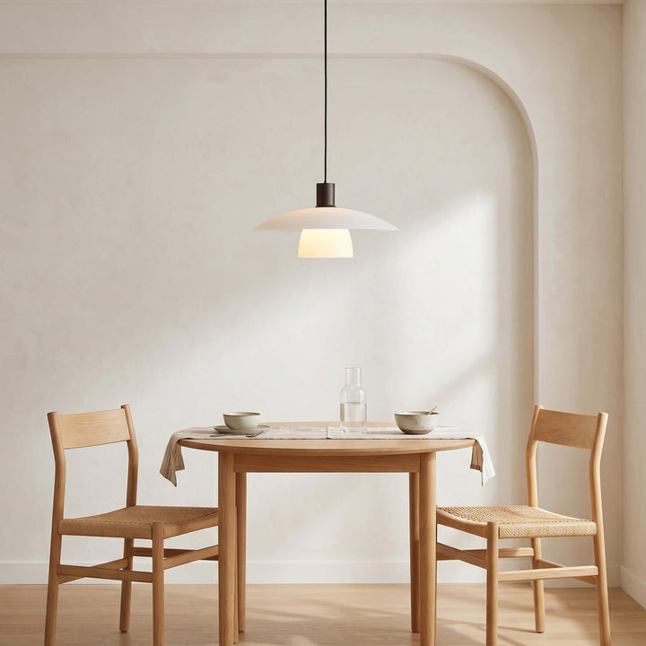 Verona pendant lamp above a small dining table for two in a bright minimalist nook