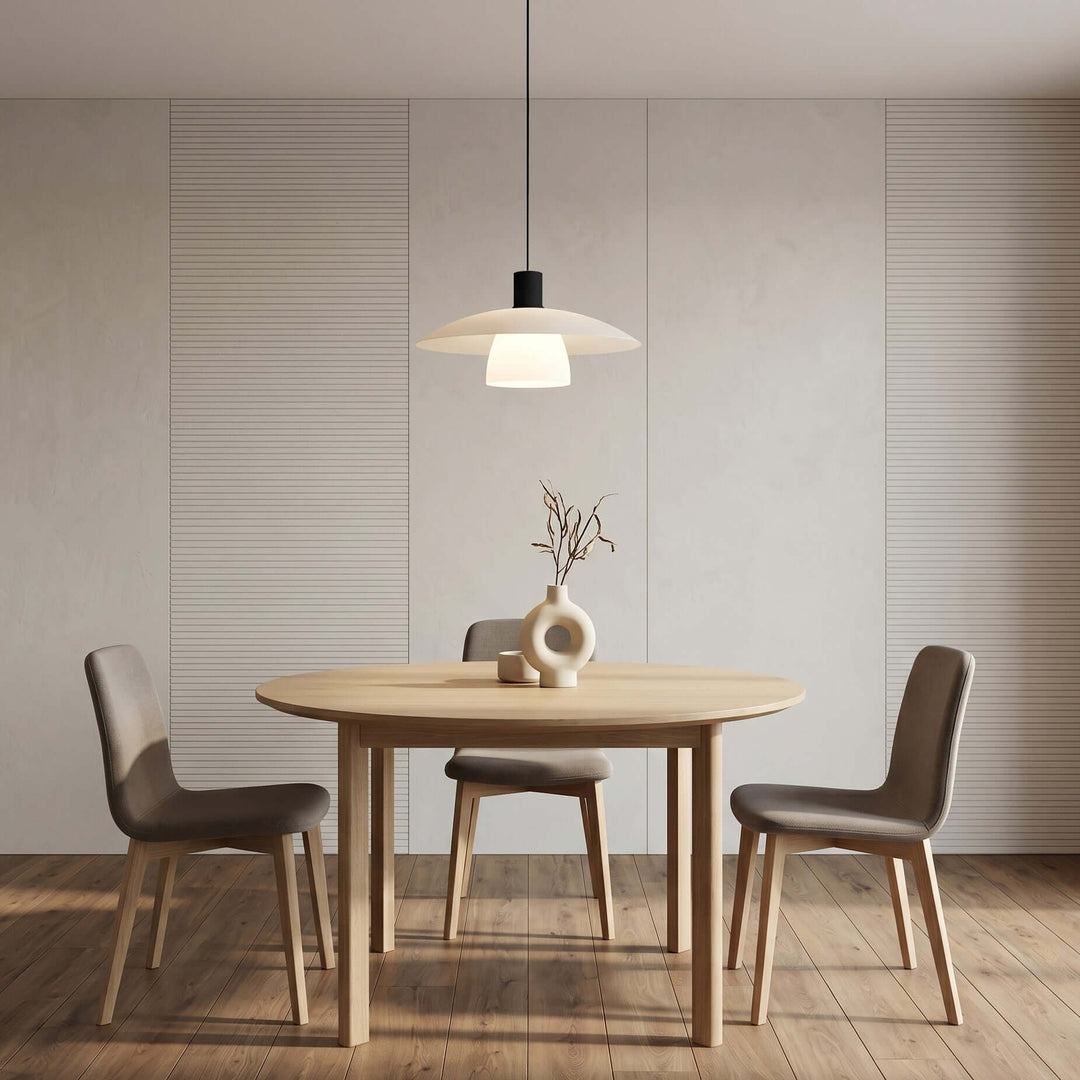 Verona pendant light above a light wood table in a bright minimalist dining room