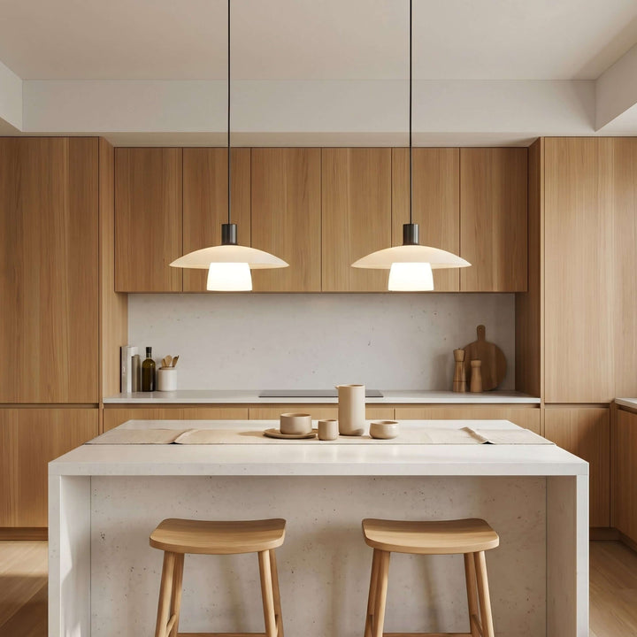 Pair of Verona pendant lights above a white kitchen island with warm wood cabinetry