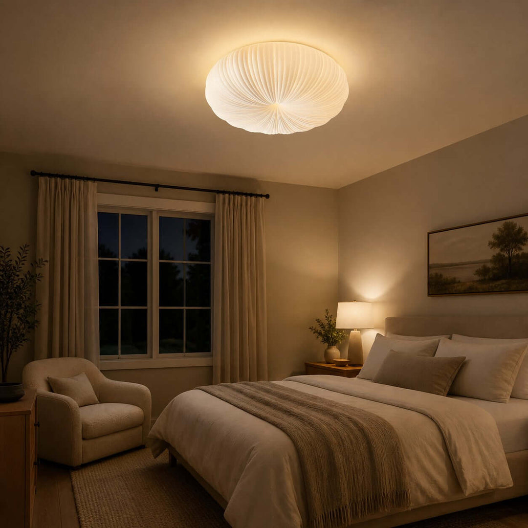 Warm glowing ceiling light above a bedroom in a dim evening scene.