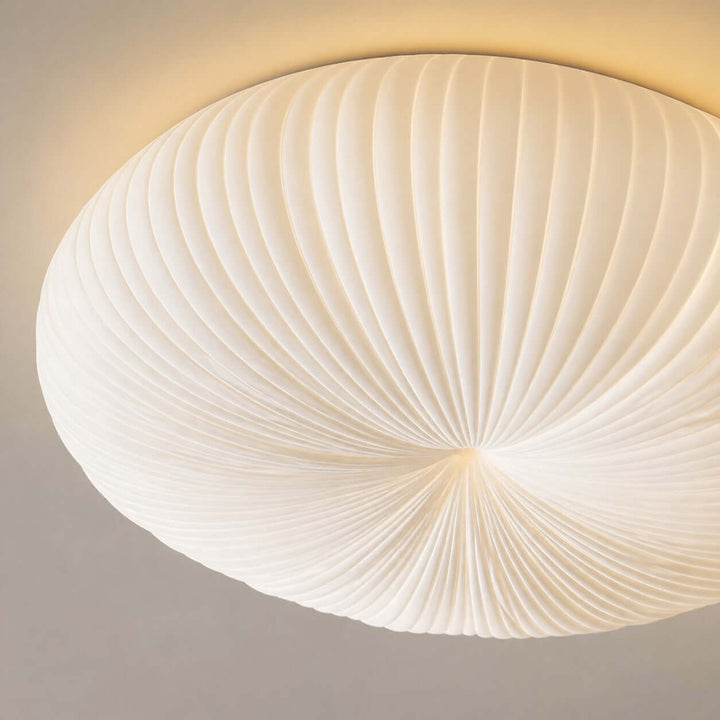 Close-up of the Bobby ceiling light showing the pleated white shade texture.