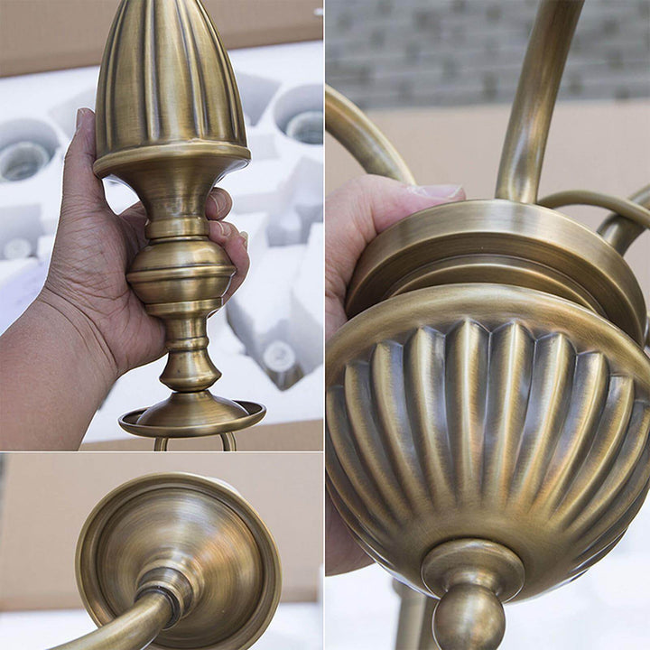 Detail views of the brass canopy, center body, and curved arms on the chandelier.