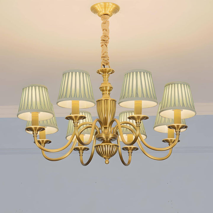 Brass Eryn chandelier with pleated fabric shades mounted close to a ceiling.