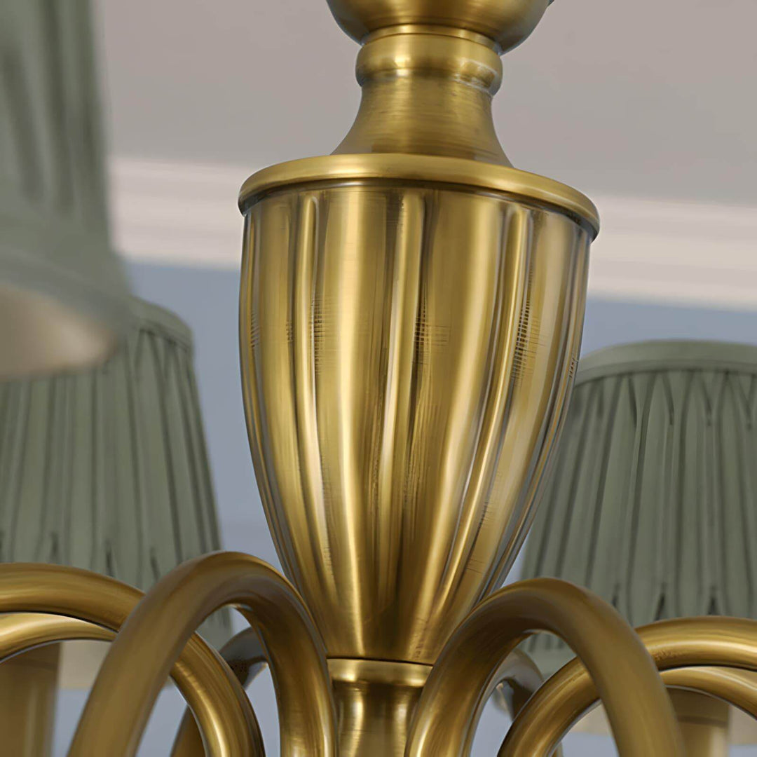 Close-up of the brass center column and pleated shades on the chandelier.