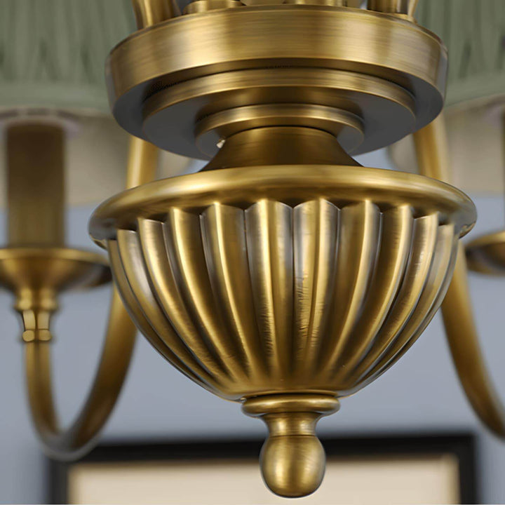 Close-up of the ribbed brass lower body on the Eryn chandelier.