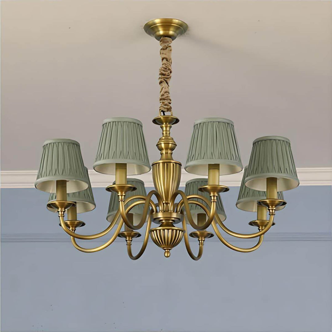 Eight-light Eryn chandelier with green pleated shades and a brass frame.