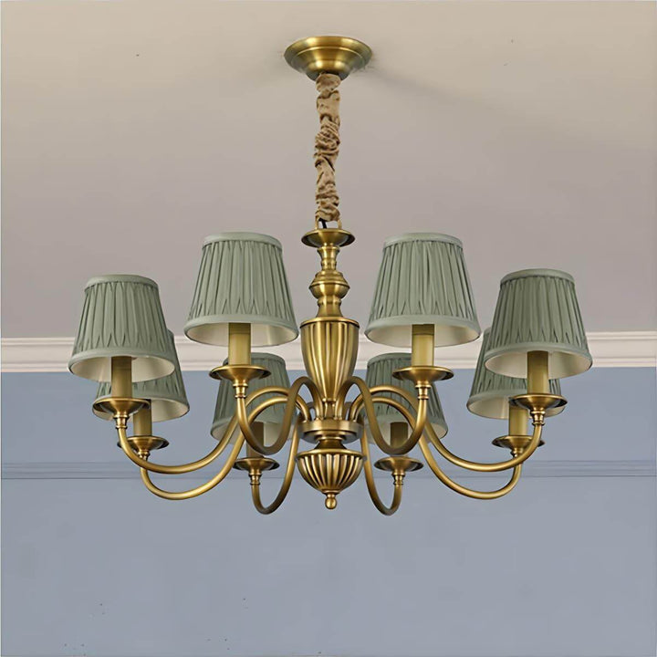 Eight-light Eryn chandelier with green pleated shades and a brass frame.
