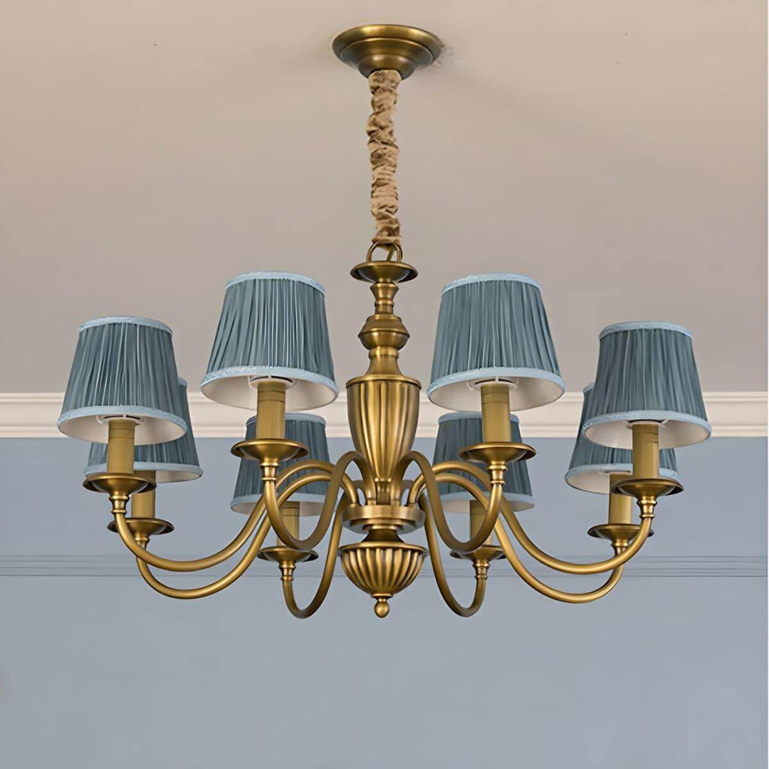 Eight-light Eryn chandelier with lake blue pleated shades and a brass frame.