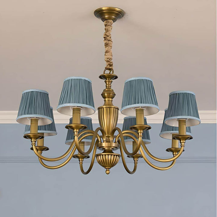 Eight-light Eryn chandelier with lake blue pleated shades and a brass frame.