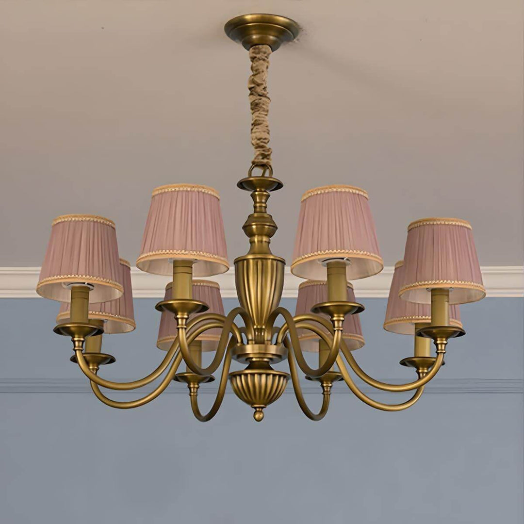 Eight-light Eryn chandelier with purple pleated shades and a brass frame.